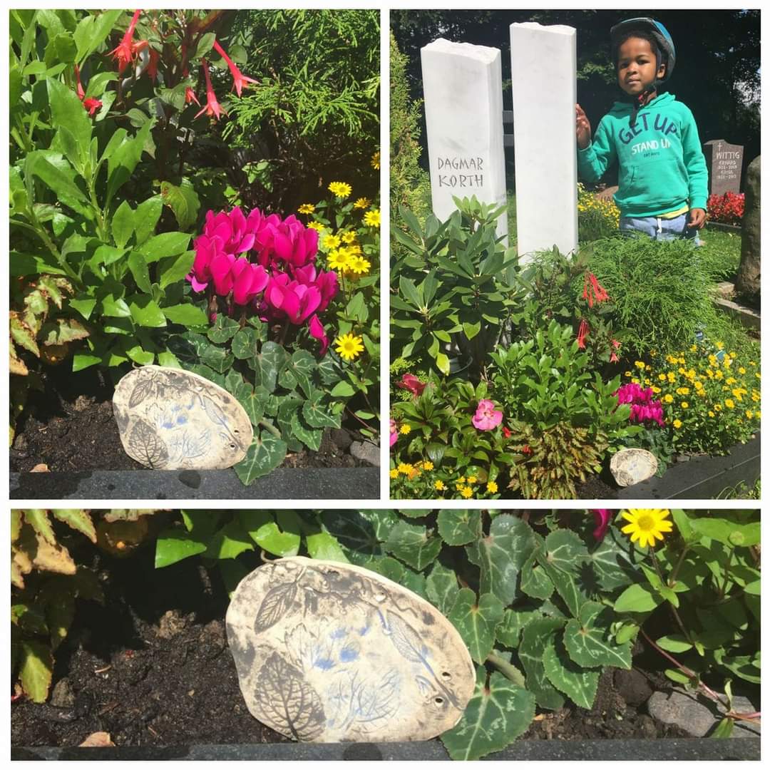 Student placing a memorial stone made at Clay Magic Pottery Studio.