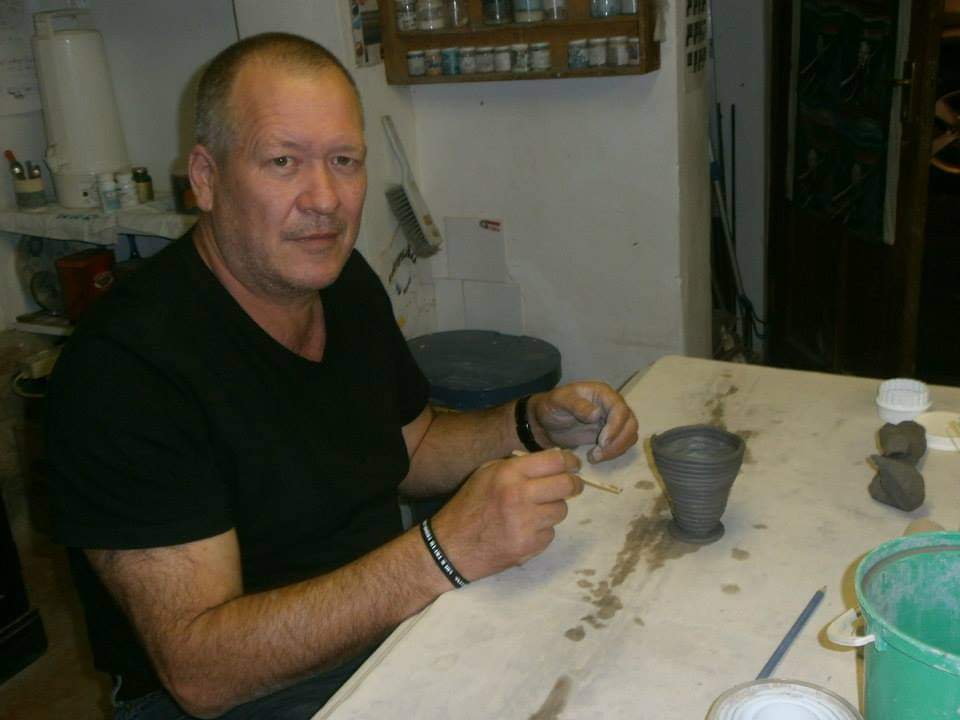 Student working with clay at Clay Magic pottery studio,
