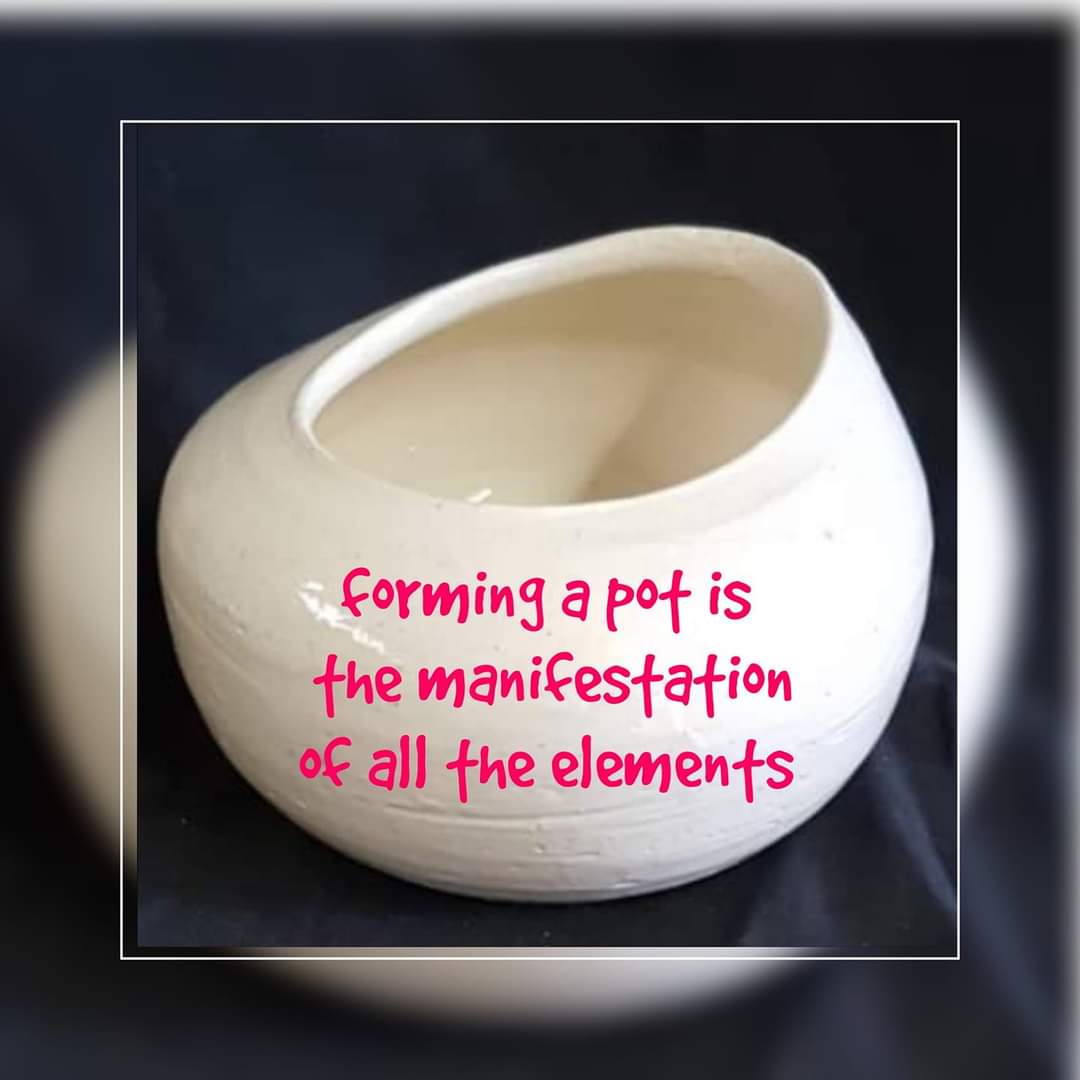 A pot with a quote on it at Clay Magic Pottery Studio.