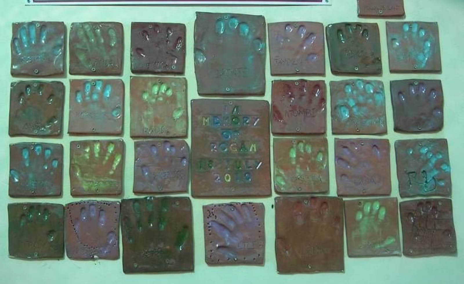 Learners' handprints created for a memorial at Clay Magic pottery studio.