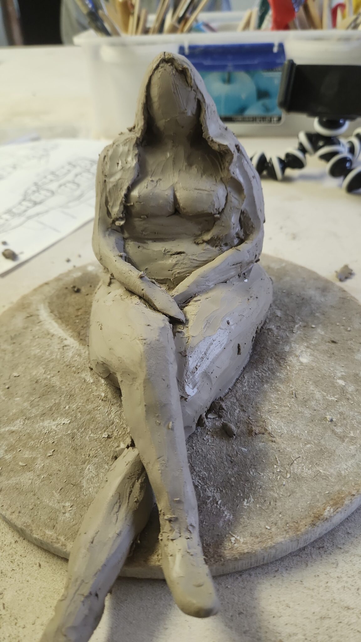 Clay Sculpture of a women's body and embracing body acceptance