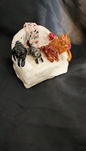 Pets on couch sculpture Pets on couch sculpture created by a young student at Clay Magic pottery studio.