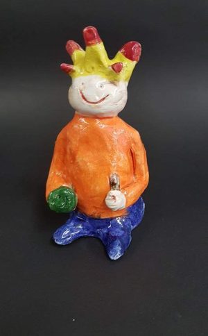 Sculpture of a man created by a young student at Clay Magic Pottery Studio.