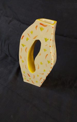 Young student's modern vase at Clay Magic pottery studio.