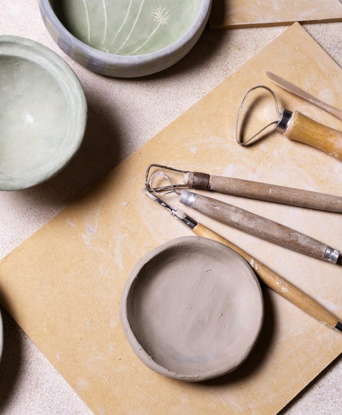 Pottery tools on a table Pottery tools arranged on a table at Clay Magic Pottery Studio.